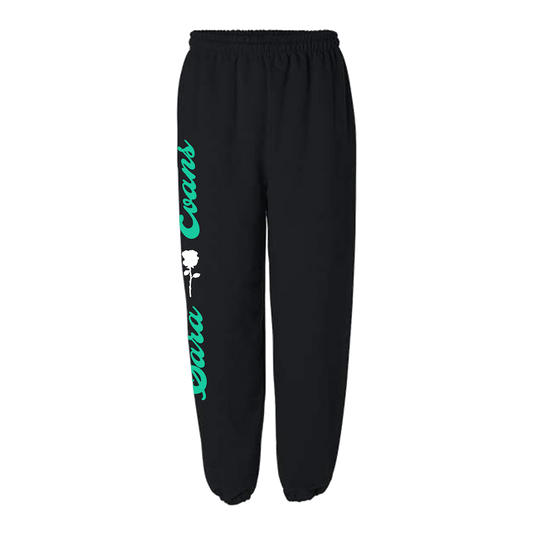 Black sweatpants with green and white text on the leg, indicating the brand 'Sara Evans'.